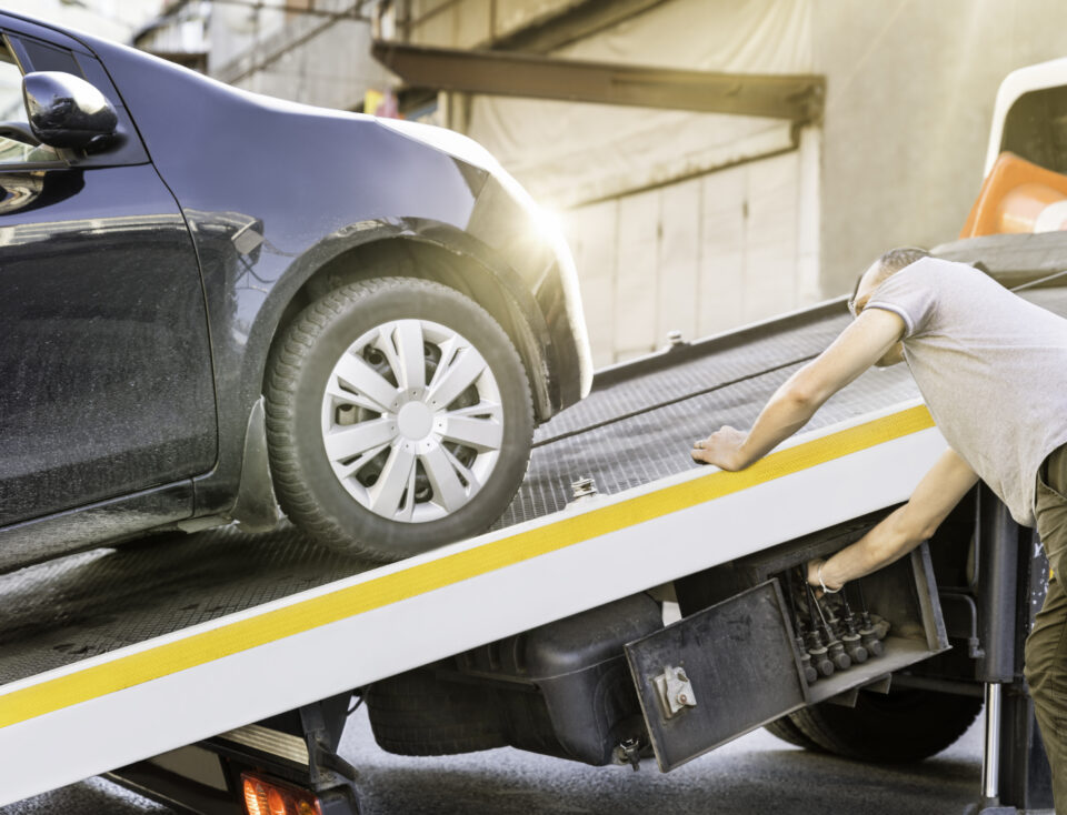 Car Loaded Onto A Recovery Truck For Transportation